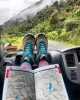 Traveler holding a map on their lap in the passenger seat