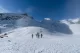 Group hiking across snowy plains