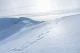 Frozen pond in snowy hills